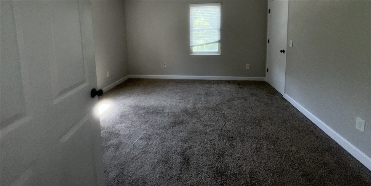 115 Mountain Springs Road West Union, SC 29696 - Photo 11 of 17 Plush carpeting and baseboard trim define this comfortable, private living area.
