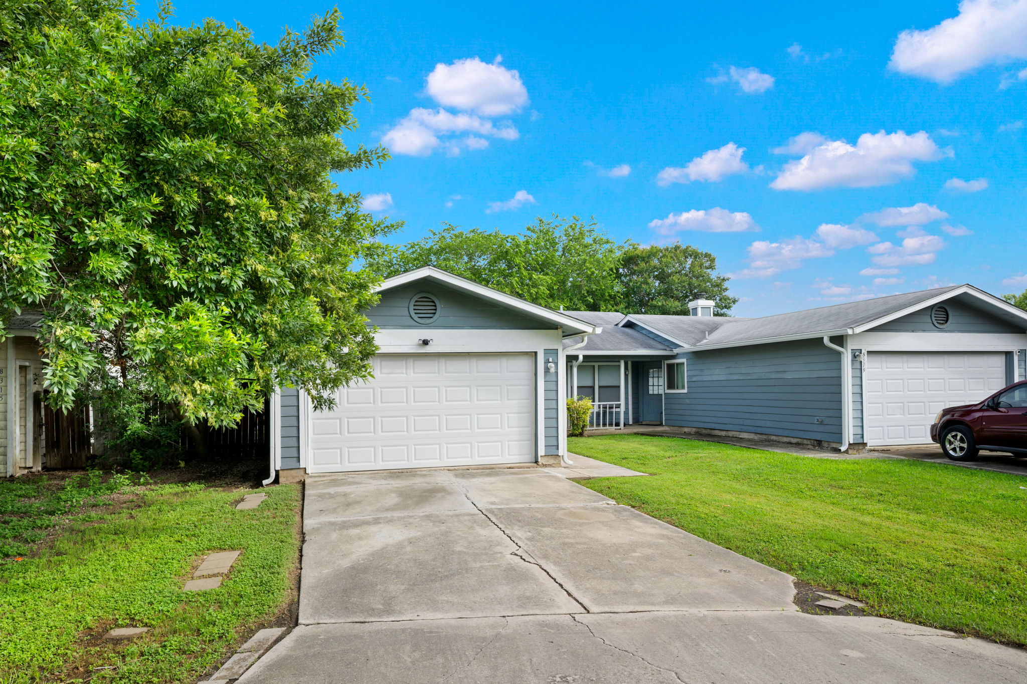 8317 Forest Ridge Drive San Antonio, TX 78239 - Photo 26 of 26 A classic ranch-style home featuring a well-maintained lawn and a convenient attached garage.