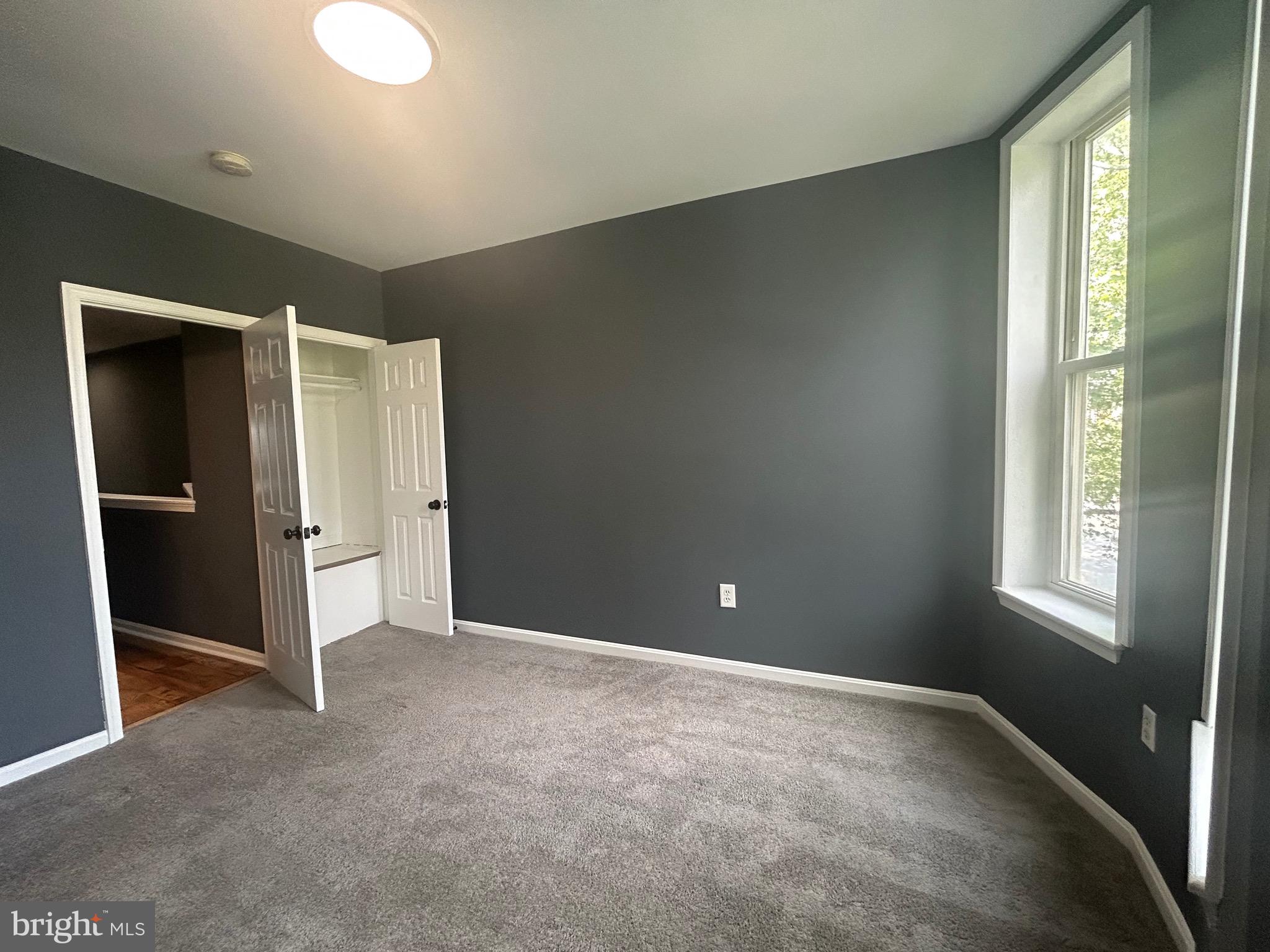 1516 North Mount Street Baltimore, MD 21217 - Photo 15 of 30 an empty room with windows and closet