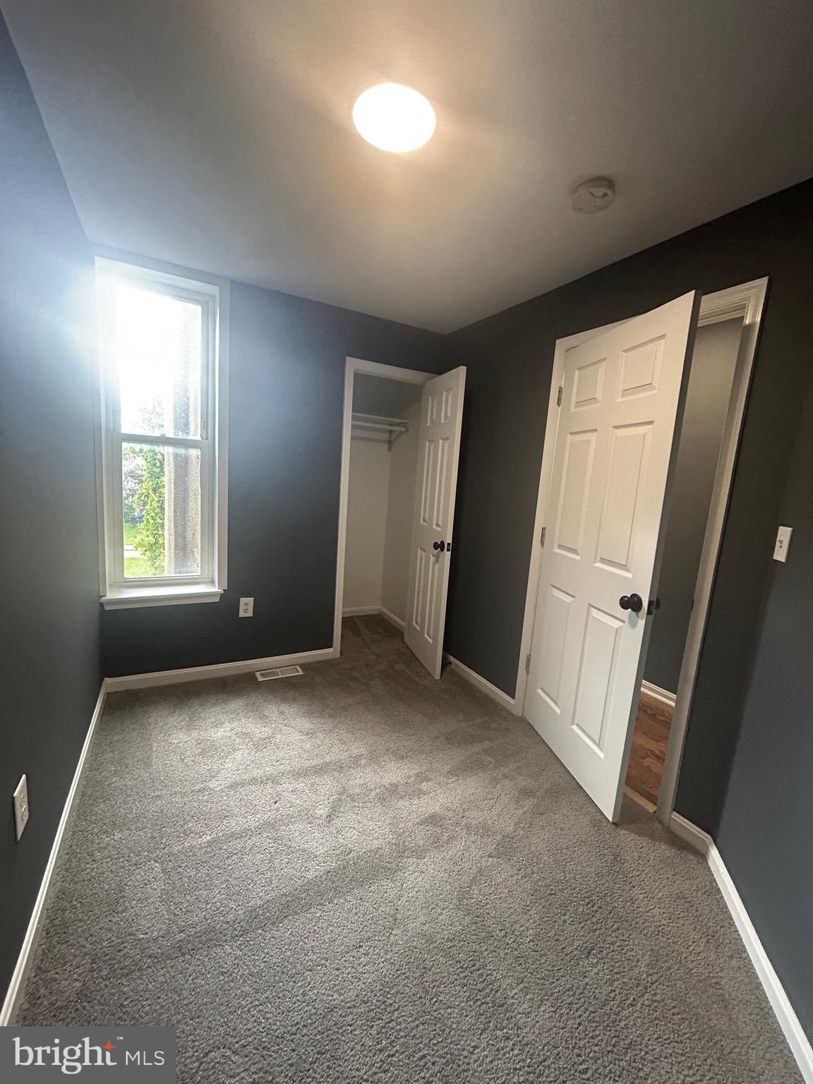 1516 North Mount Street Baltimore, MD 21217 - Photo 21 of 30 an empty room with windows and closet