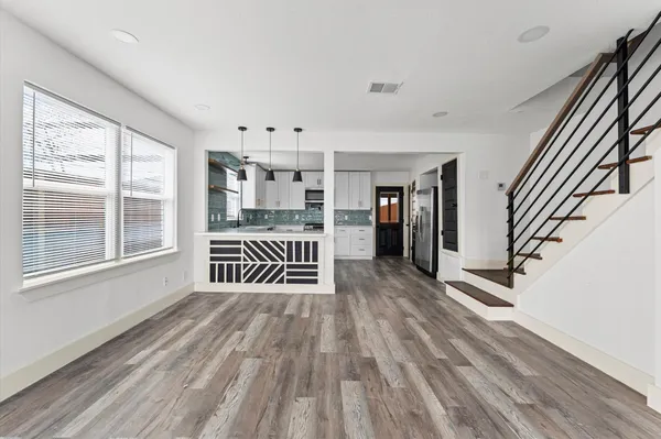 a view of entryway with stairs and wooden floor