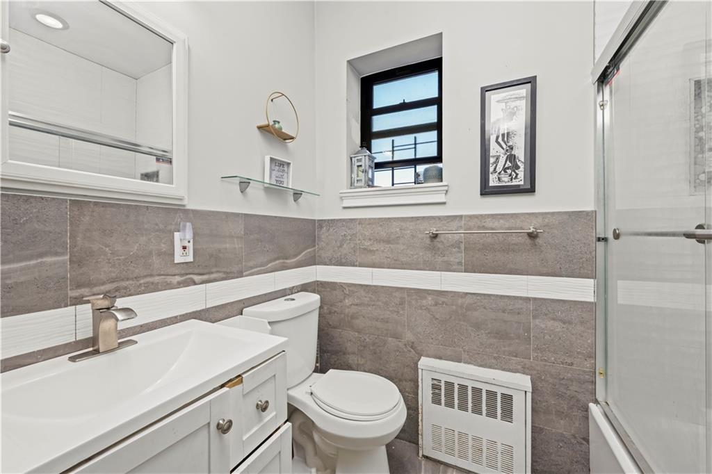 9 Argyle Road, Unit 4C Brooklyn, NY 11218 - Photo 16 of 22 a bathroom with a sink toilet and window
