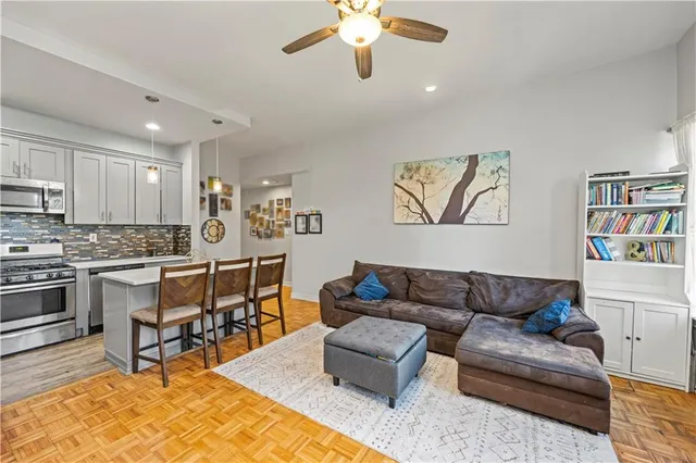 a kitchen with stainless steel appliances granite countertop a sink and a refrigerator