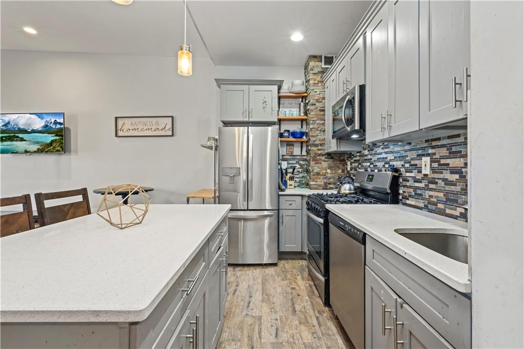 9 Argyle Road, Unit 4C Brooklyn, NY 11218 - Photo 10 of 22 a kitchen with stainless steel appliances granite countertop a sink and a refrigerator