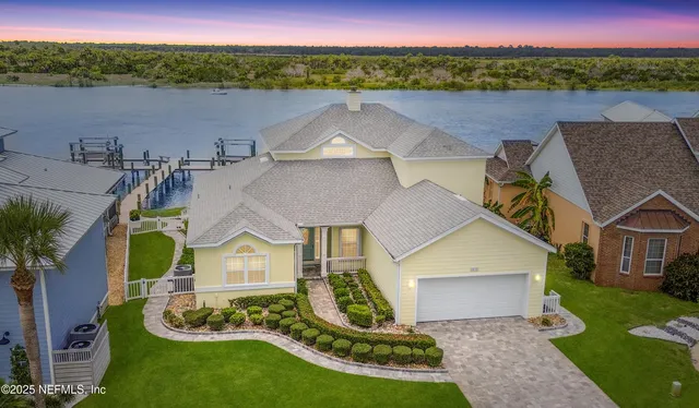 a front view of a house with a ocean view