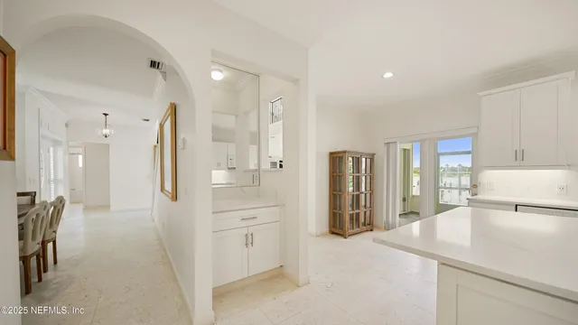 a view of a livingroom with furniture and a flat screen tv