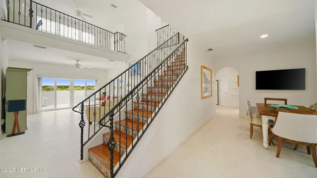a bedroom with a bed chair and window