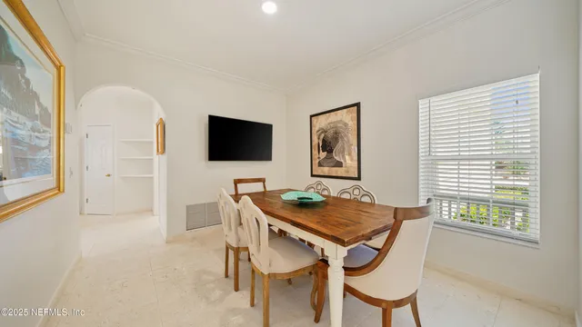 a bedroom with a bed and a night stand