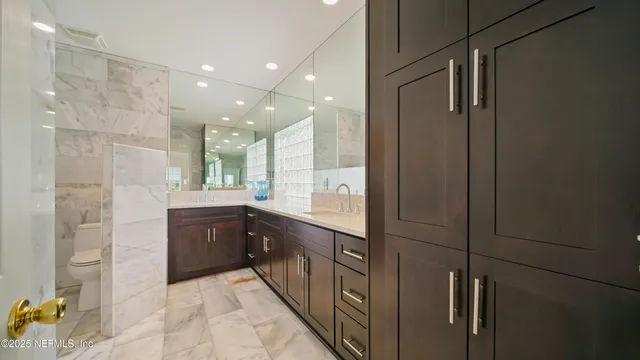 a bathroom with a sink double vanity and a shower