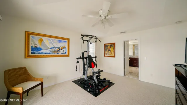 a view of a house with a small yard and sitting area
