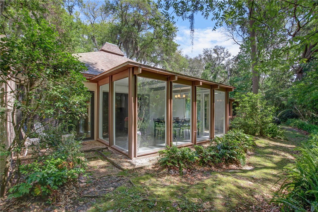 3203 Sea Marsh Road Fernandina Beach, FL 32034 - Photo 31 of 34 a front view of a house with garden