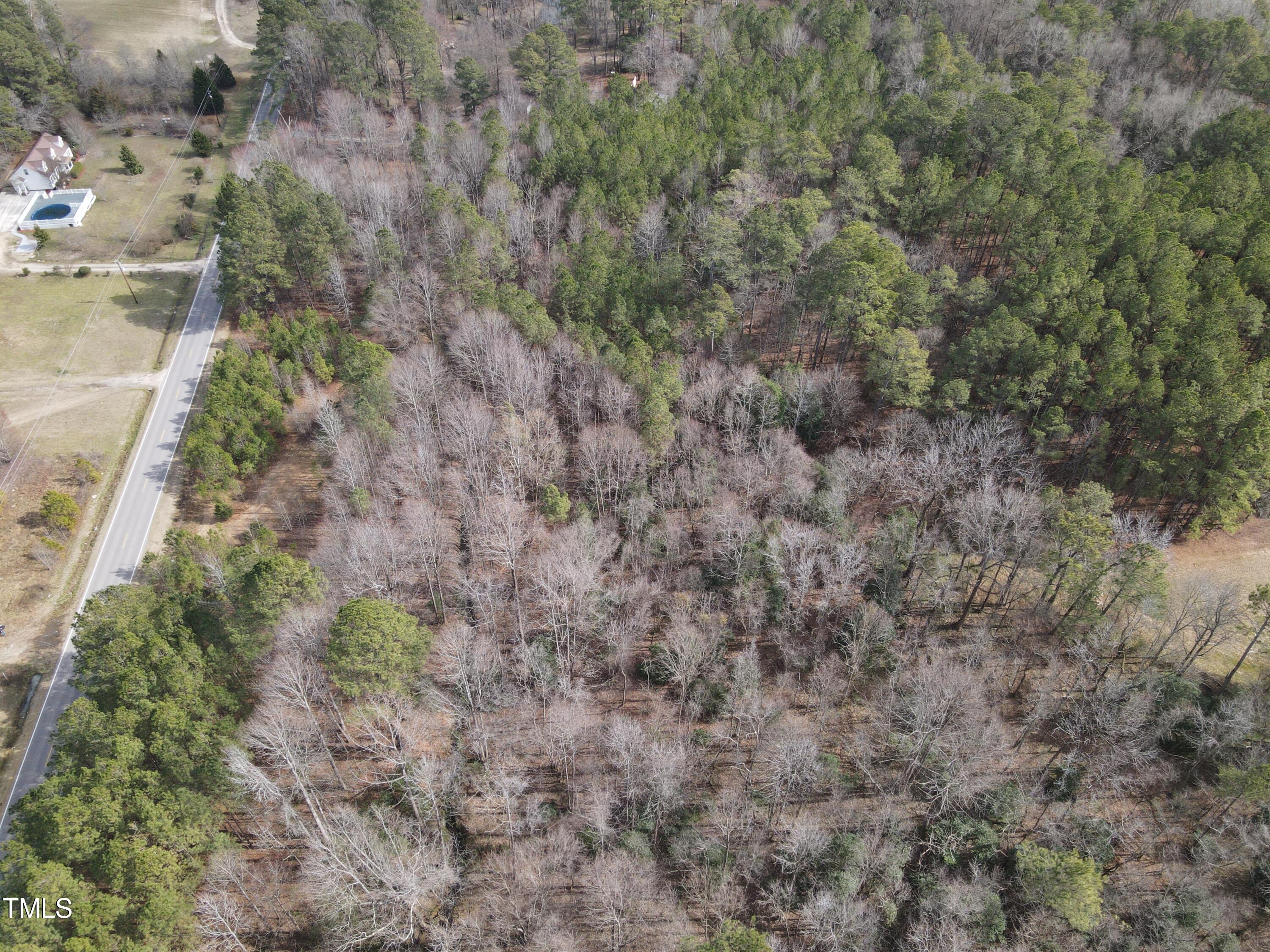 8132 Fowler Road Zebulon, NC 27597 - Photo 7 of 9 a view of a yard with a tree