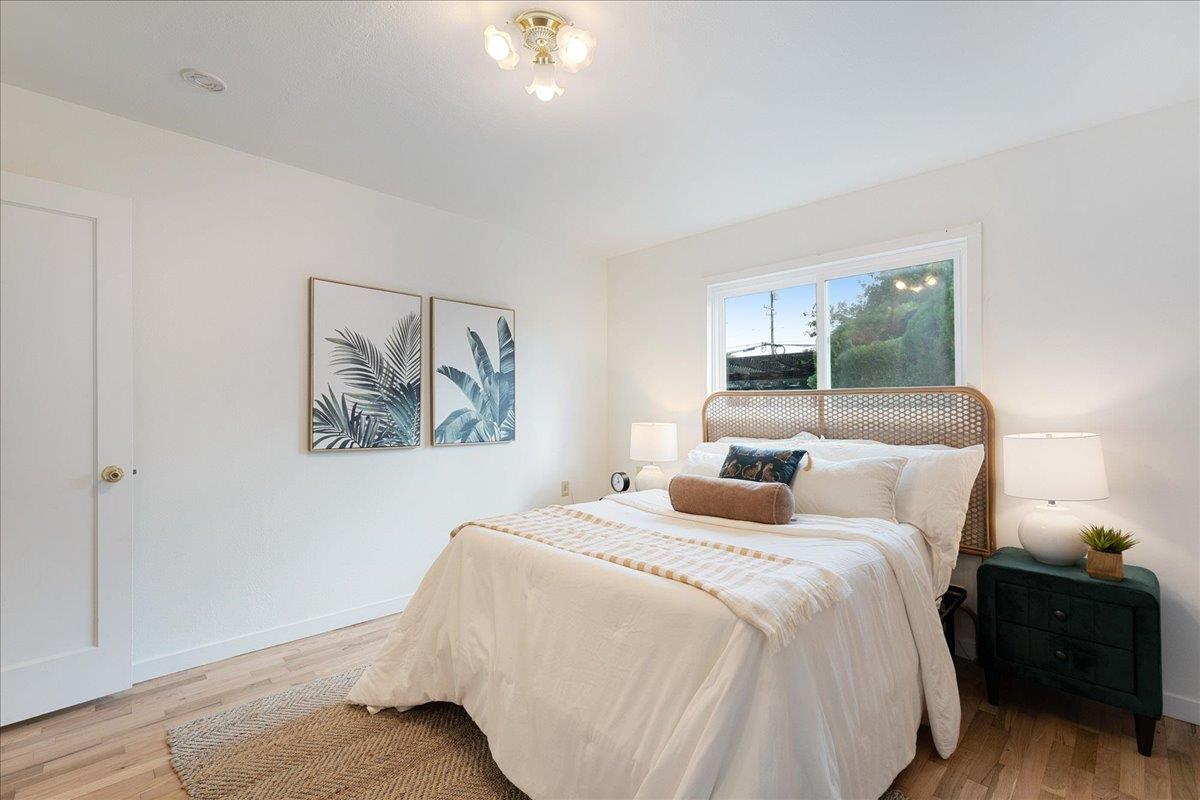 2908 Sandy Lane Santa Cruz, CA 95062 - Photo 13 of 28 a bedroom with a bed and a painting on the wall