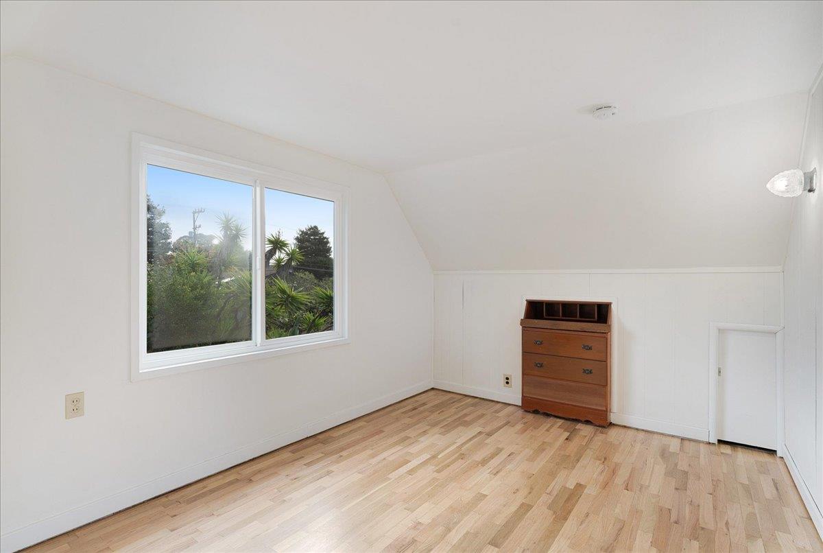 2908 Sandy Lane Santa Cruz, CA 95062 - Photo 16 of 28 an empty room with wooden floor and windows