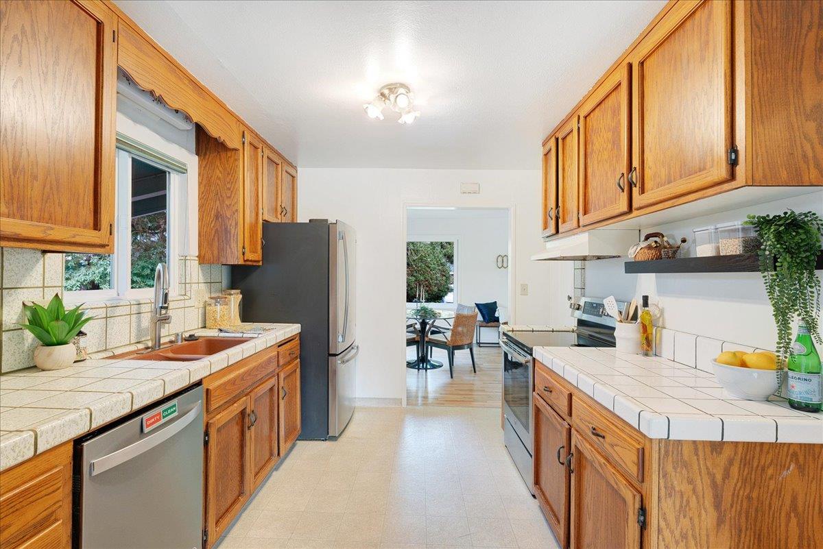 2908 Sandy Lane Santa Cruz, CA 95062 - Photo 5 of 28 a kitchen with stainless steel appliances granite countertop a sink and cabinets