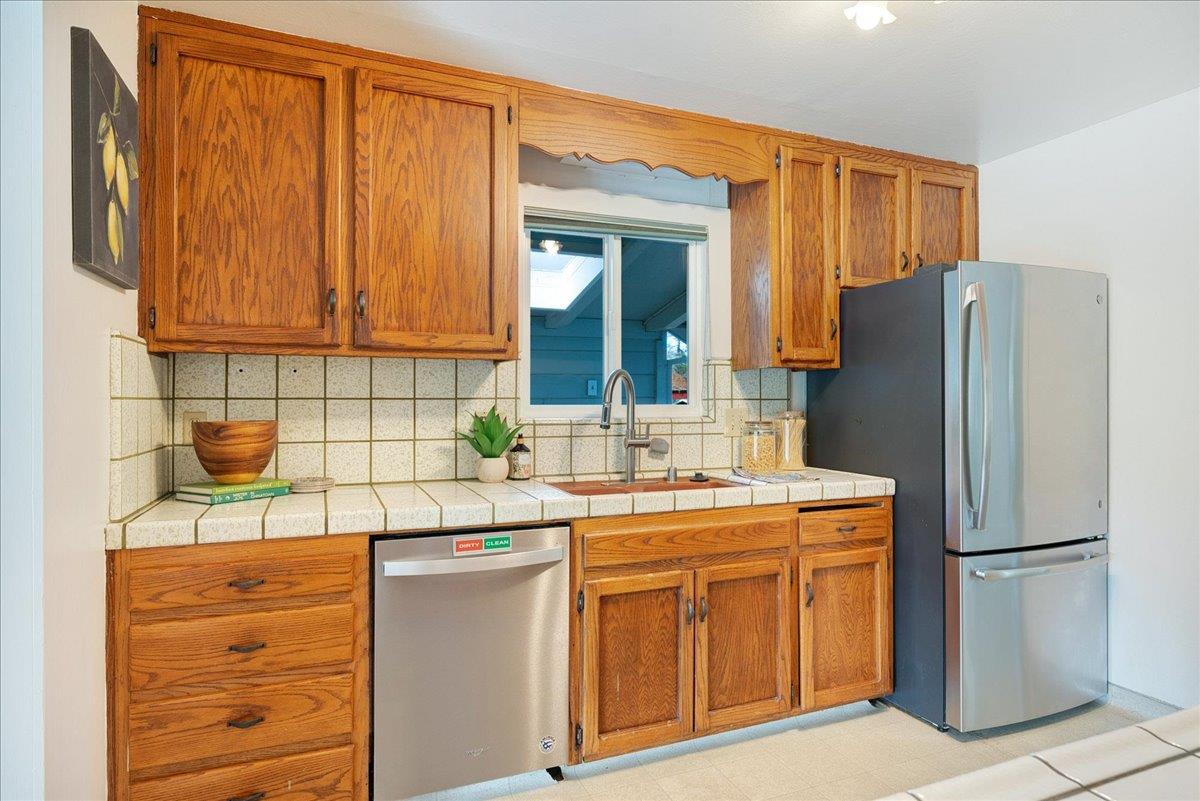 2908 Sandy Lane Santa Cruz, CA 95062 - Photo 6 of 28 a kitchen with stainless steel appliances granite countertop a refrigerator and a sink