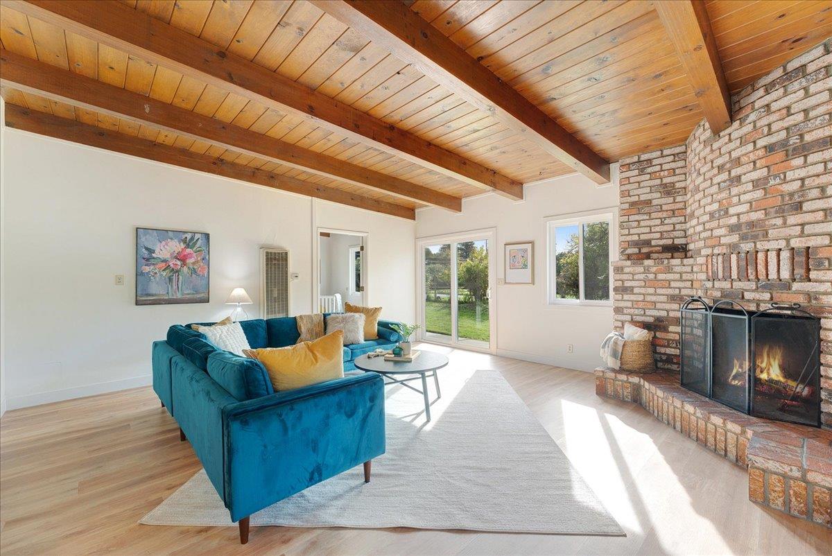 2908 Sandy Lane Santa Cruz, CA 95062 - Photo 8 of 28 a living room with furniture and a fireplace