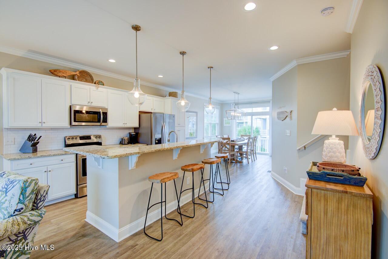 2800 West Fort Macon Road, Unit 13 SEASIDE VILLAS Atlantic Beach, NC 28512 - Photo 12 of 56 Open kitchen, dining, and living room