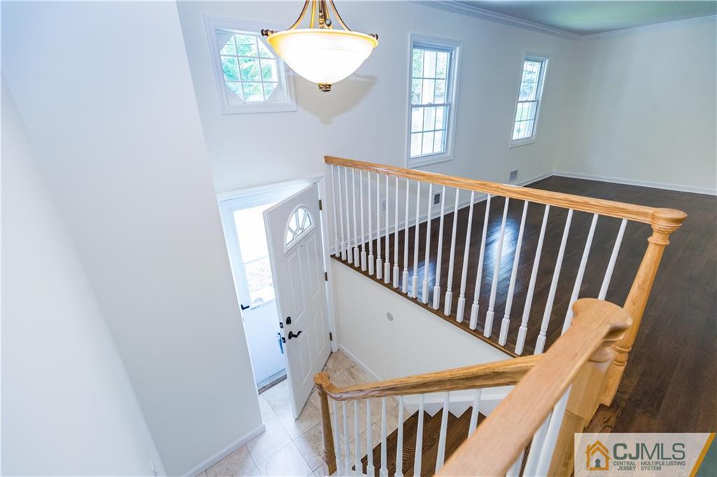 1264 Washington Valley Road Bridgewater, NJ 08807 - Photo 3 of 25 a view of staircase with railing and white walls
