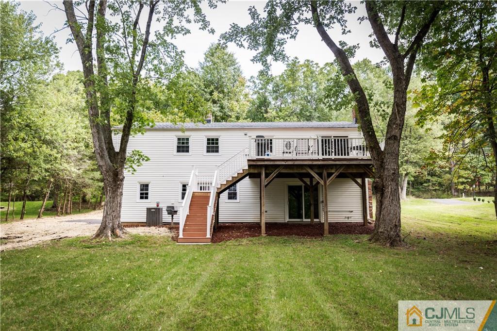 1264 Washington Valley Road Bridgewater, NJ 08807 - Photo 24 of 25 a view of a house with backyard and tree