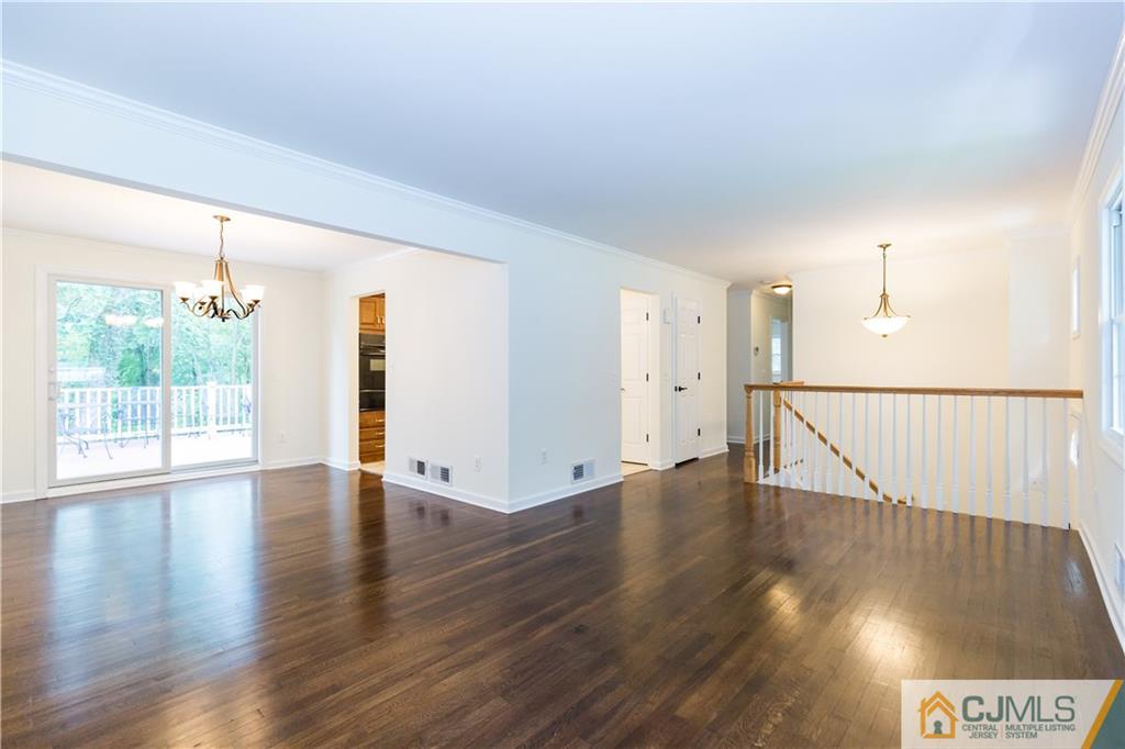 1264 Washington Valley Road Bridgewater, NJ 08807 - Photo 5 of 25 a view of an empty room with wooden floor and a window
