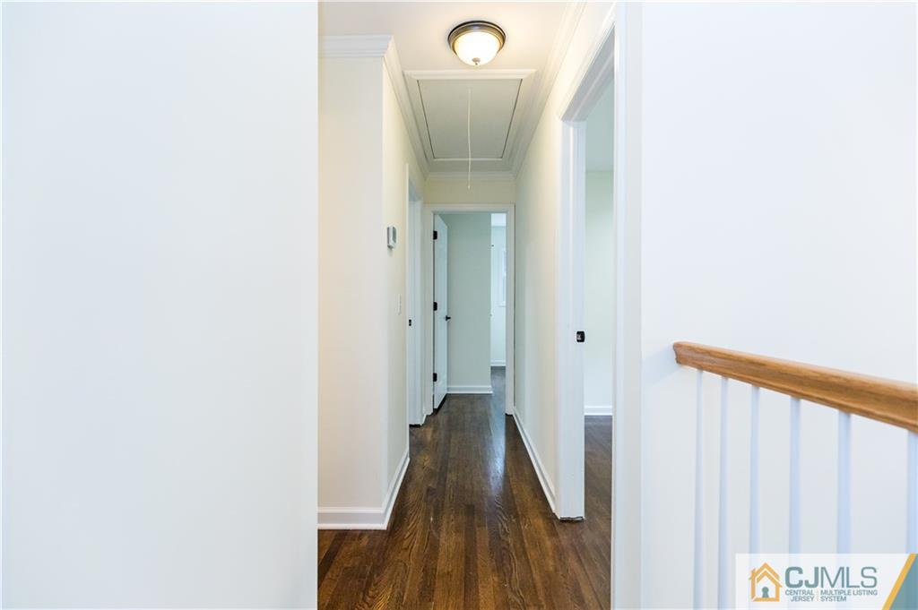 1264 Washington Valley Road Bridgewater, NJ 08807 - Photo 9 of 25 a view of a hallway with wooden floor