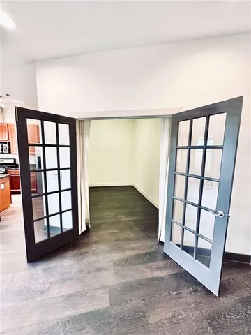 a view of wooden floor and staircase in a room