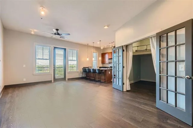 a view of a livingroom with furniture and a window