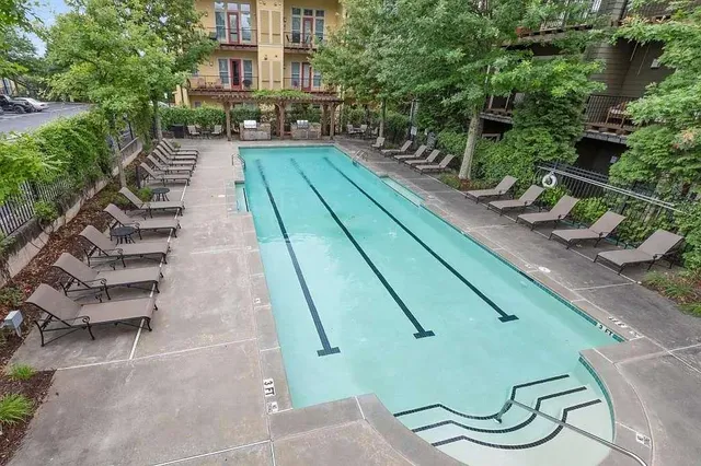 a view of a yard with chairs