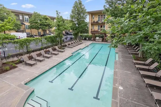 a view of a backyard with sitting area