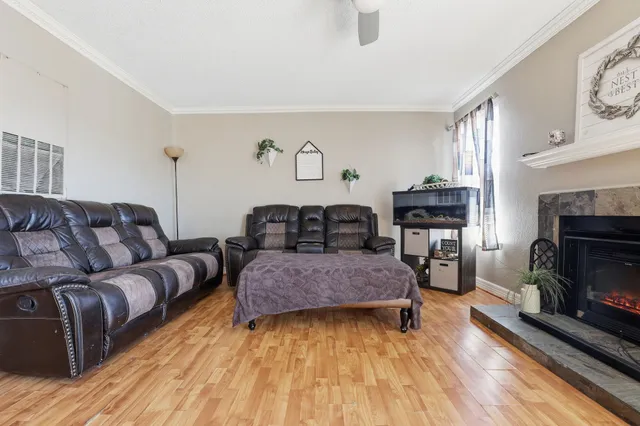 a living room with furniture and a fireplace