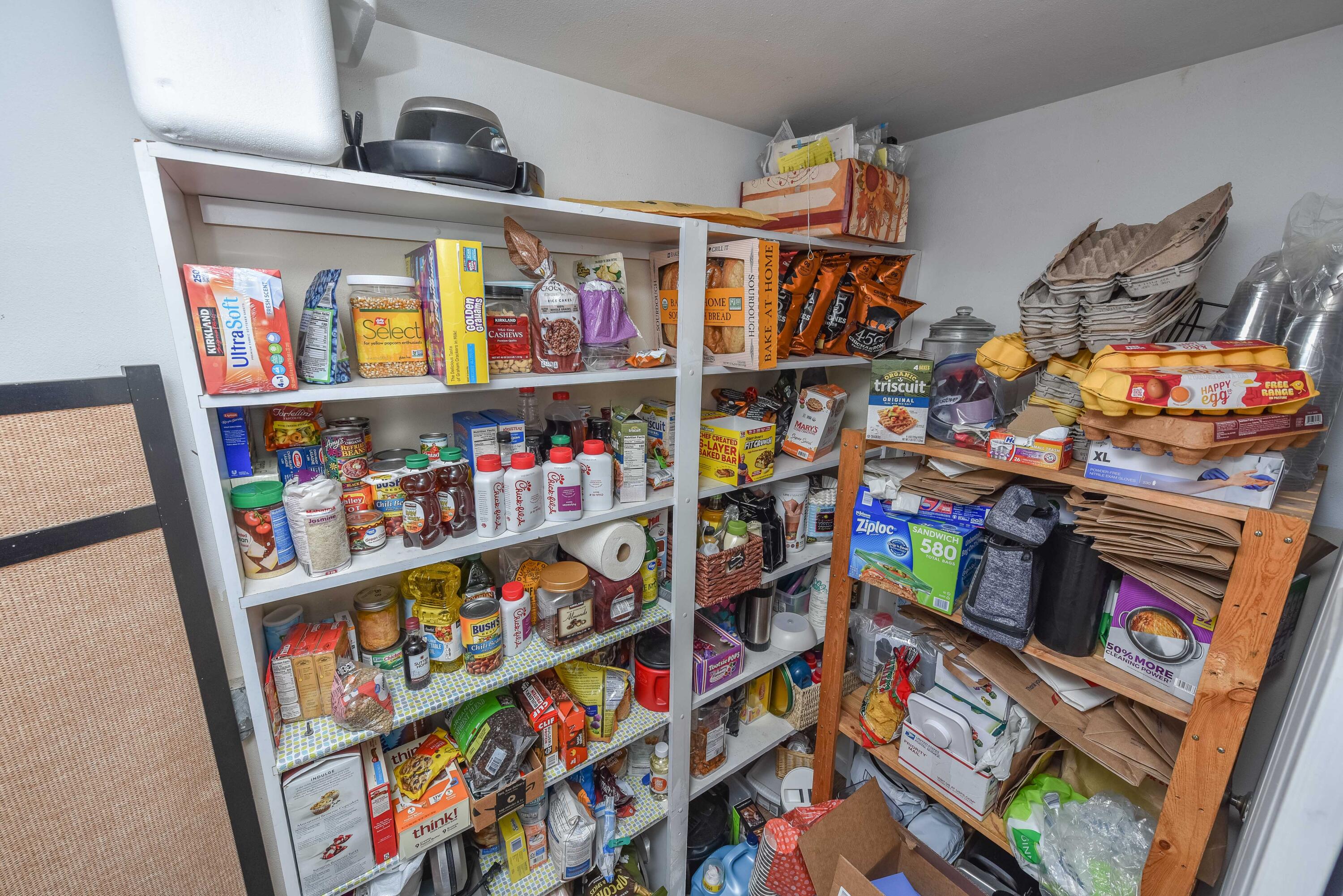 21698 Rickard Road Bend, OR 97702 - Photo 22 of 51 Pantry off the kitchen hallway has lots of shelving. The water heater is also in this room.