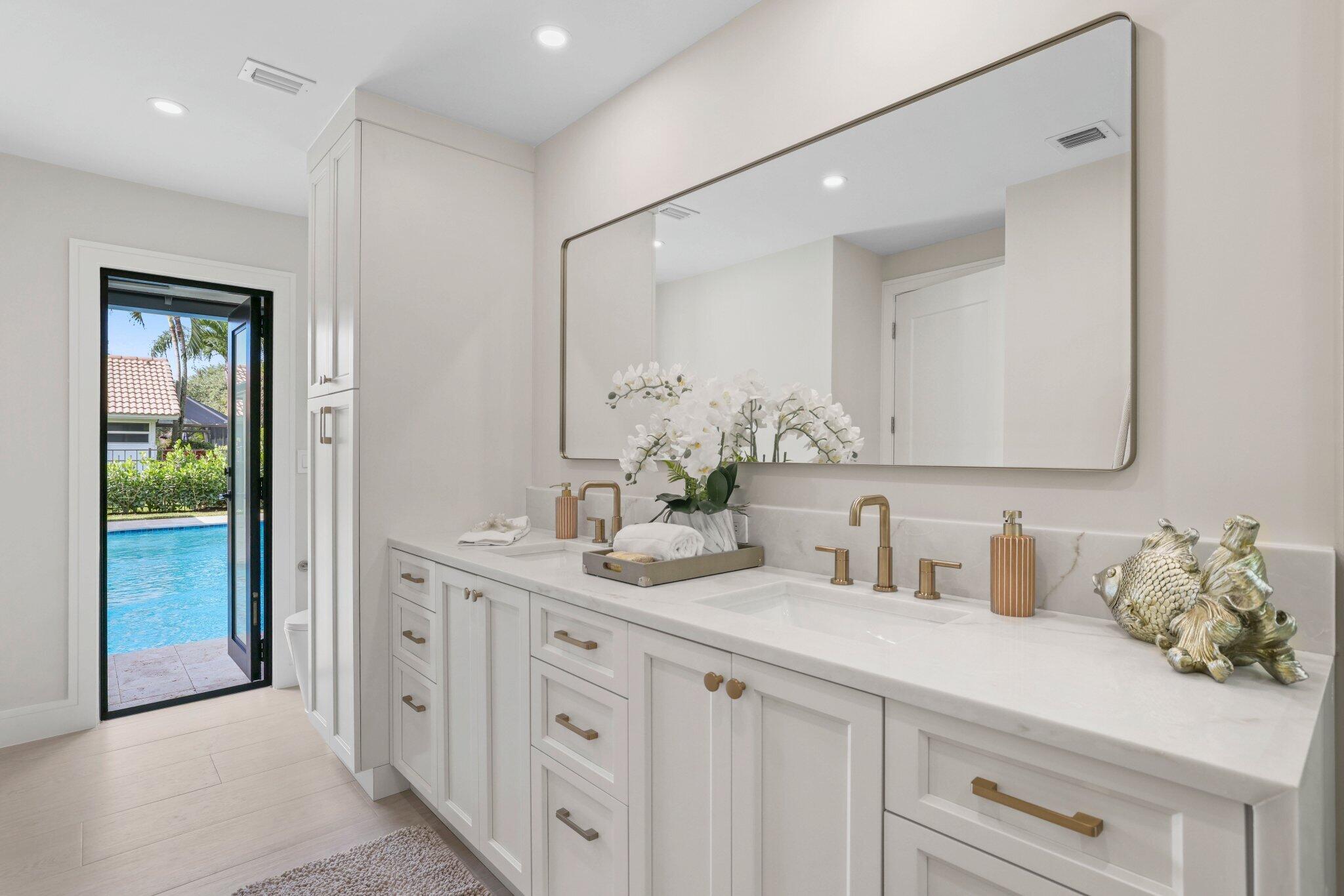3901 Northwest 27th Avenue Boca Raton, FL 33434 - Photo 39 of 56 a bathroom with a sink and a mirror