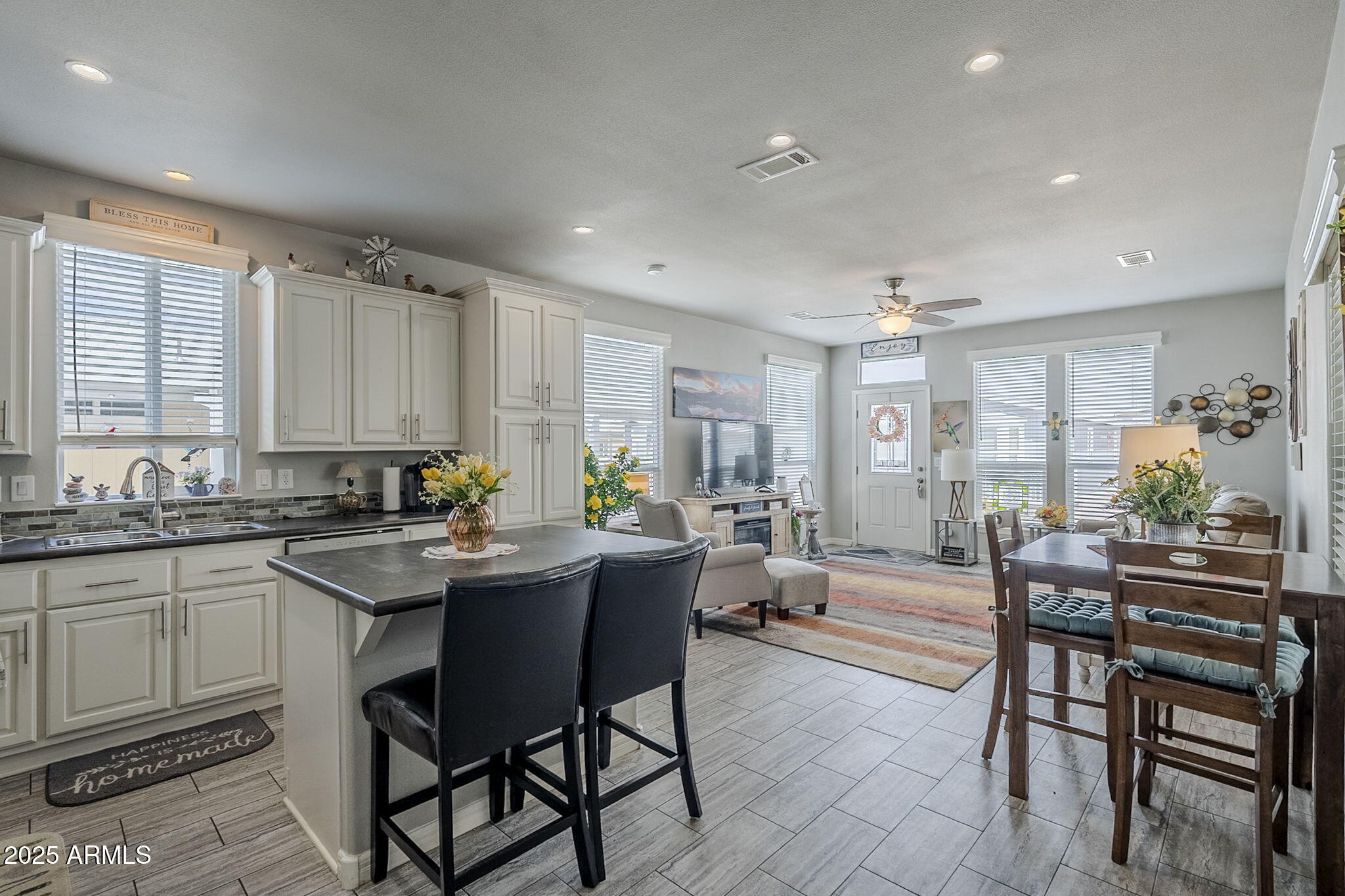 650 North Hawes Road, Unit 3215 Mesa, AZ 85207 - Photo 67 of 68 a dining hall with stainless steel appliances granite countertop a table and chairs