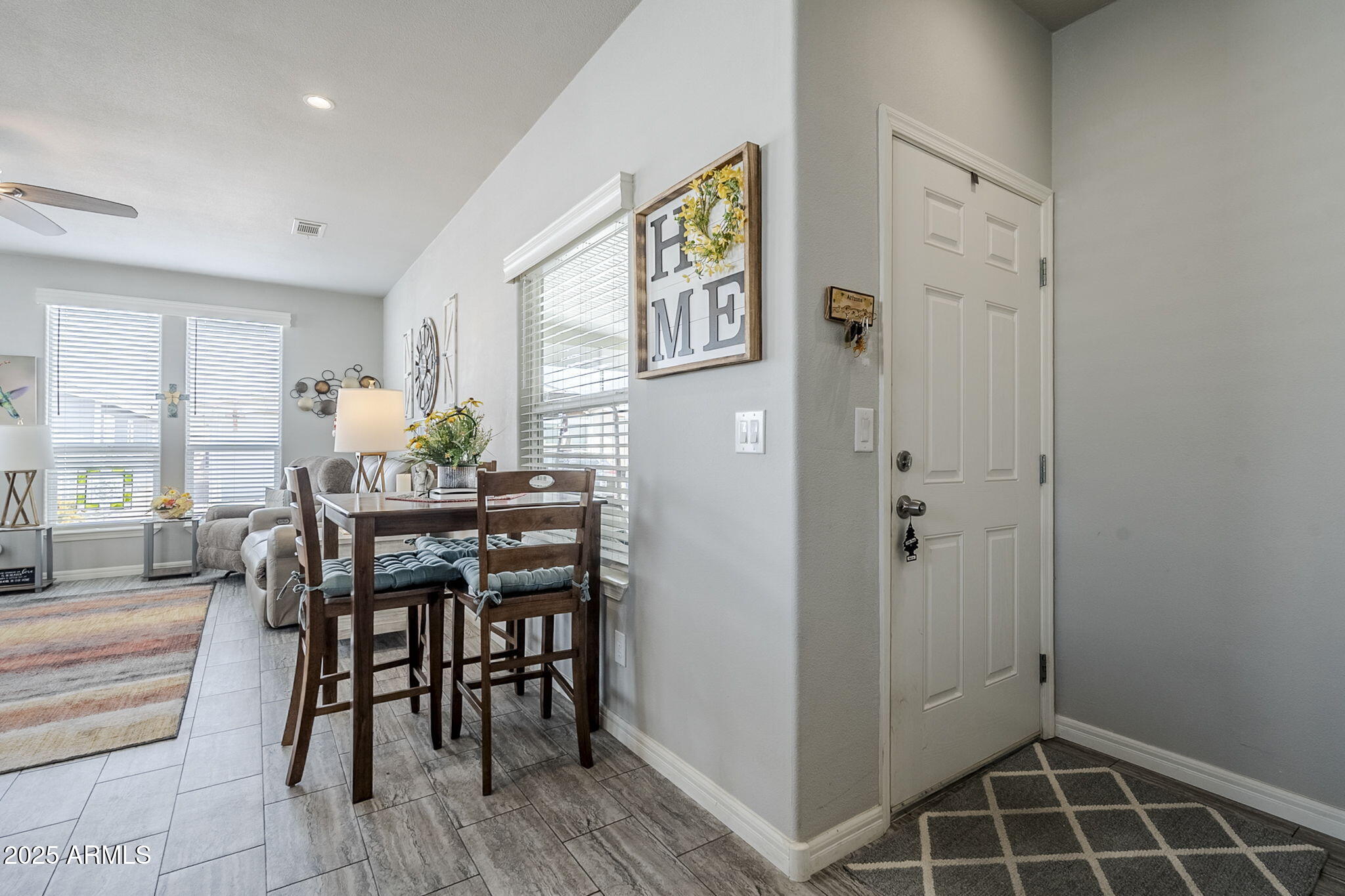 650 North Hawes Road, Unit 3215 Mesa, AZ 85207 - Photo 16 of 68 a view of a dining room with furniture and window