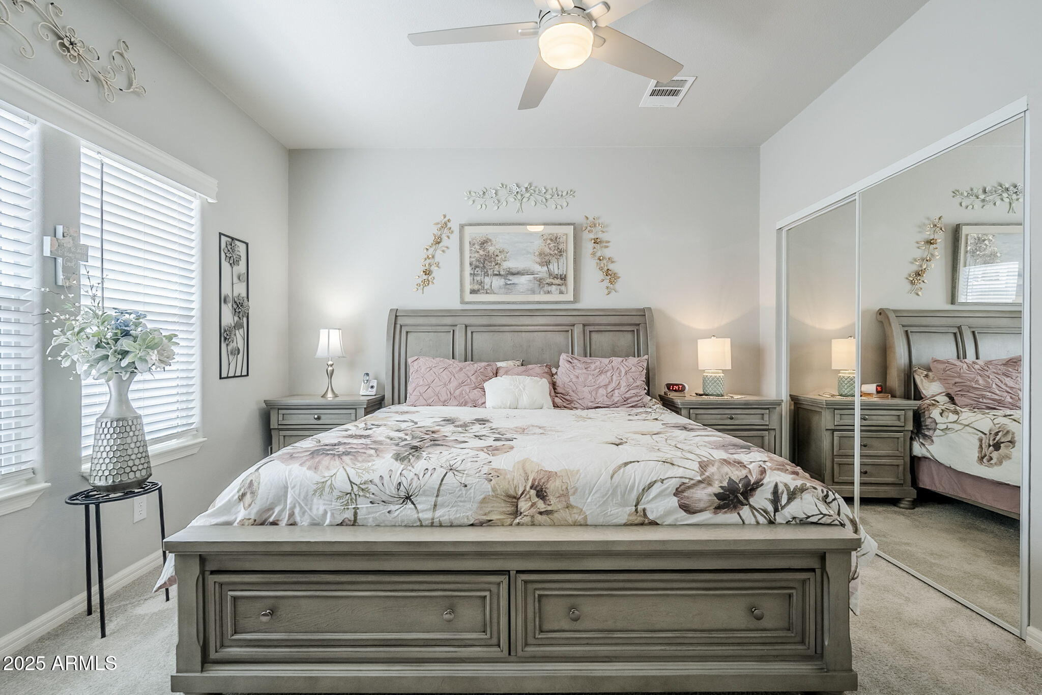 650 North Hawes Road, Unit 3215 Mesa, AZ 85207 - Photo 20 of 68 a bedroom with a bed and a chandelier