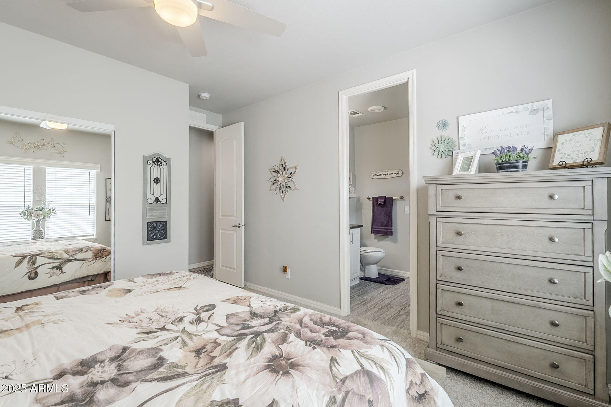 650 North Hawes Road, Unit 3215 Mesa, AZ 85207 - Photo 22 of 68 a bedroom with a bed and a mirror