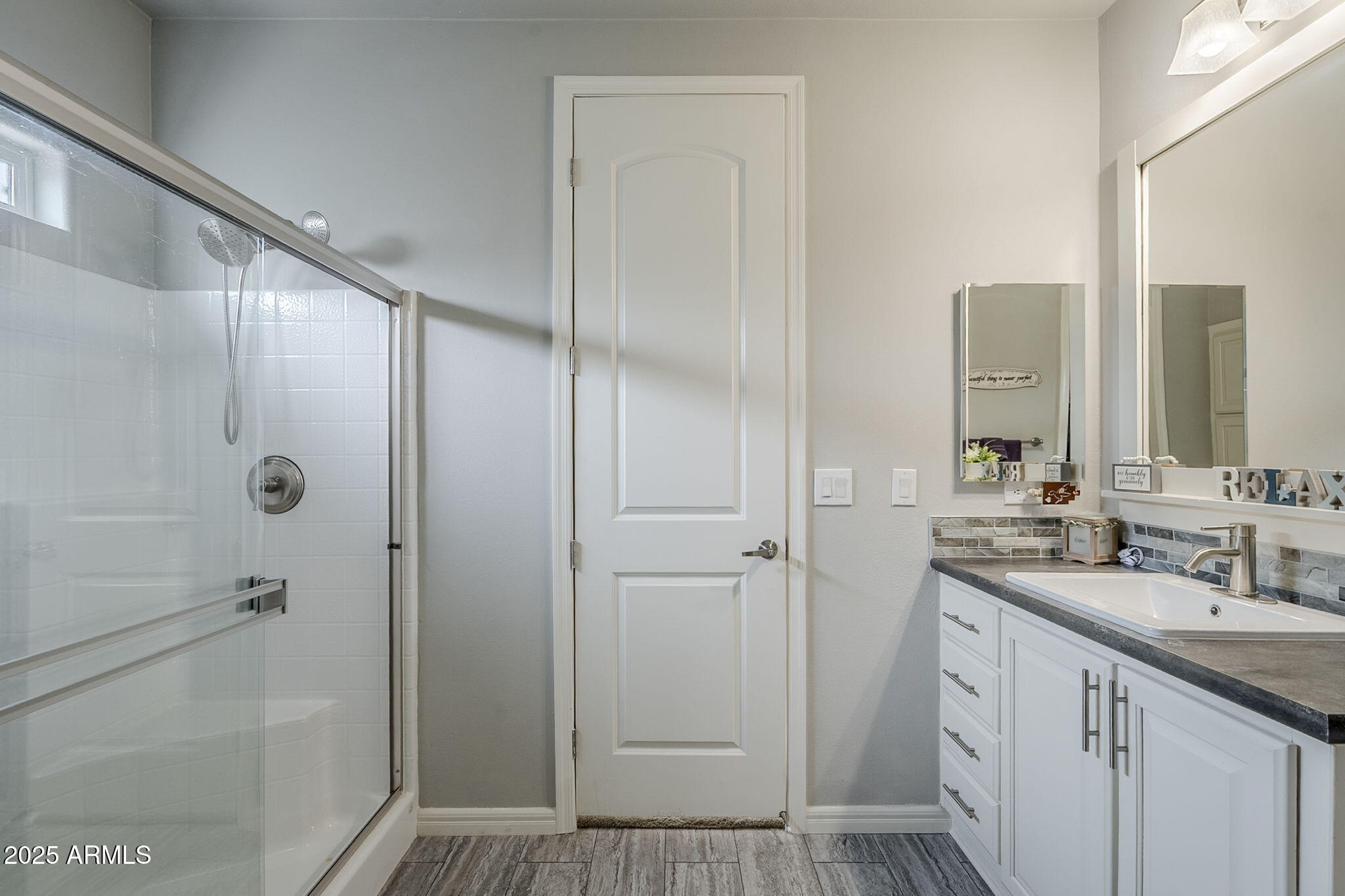 650 North Hawes Road, Unit 3215 Mesa, AZ 85207 - Photo 23 of 68 a bathroom with a shower sink and mirror