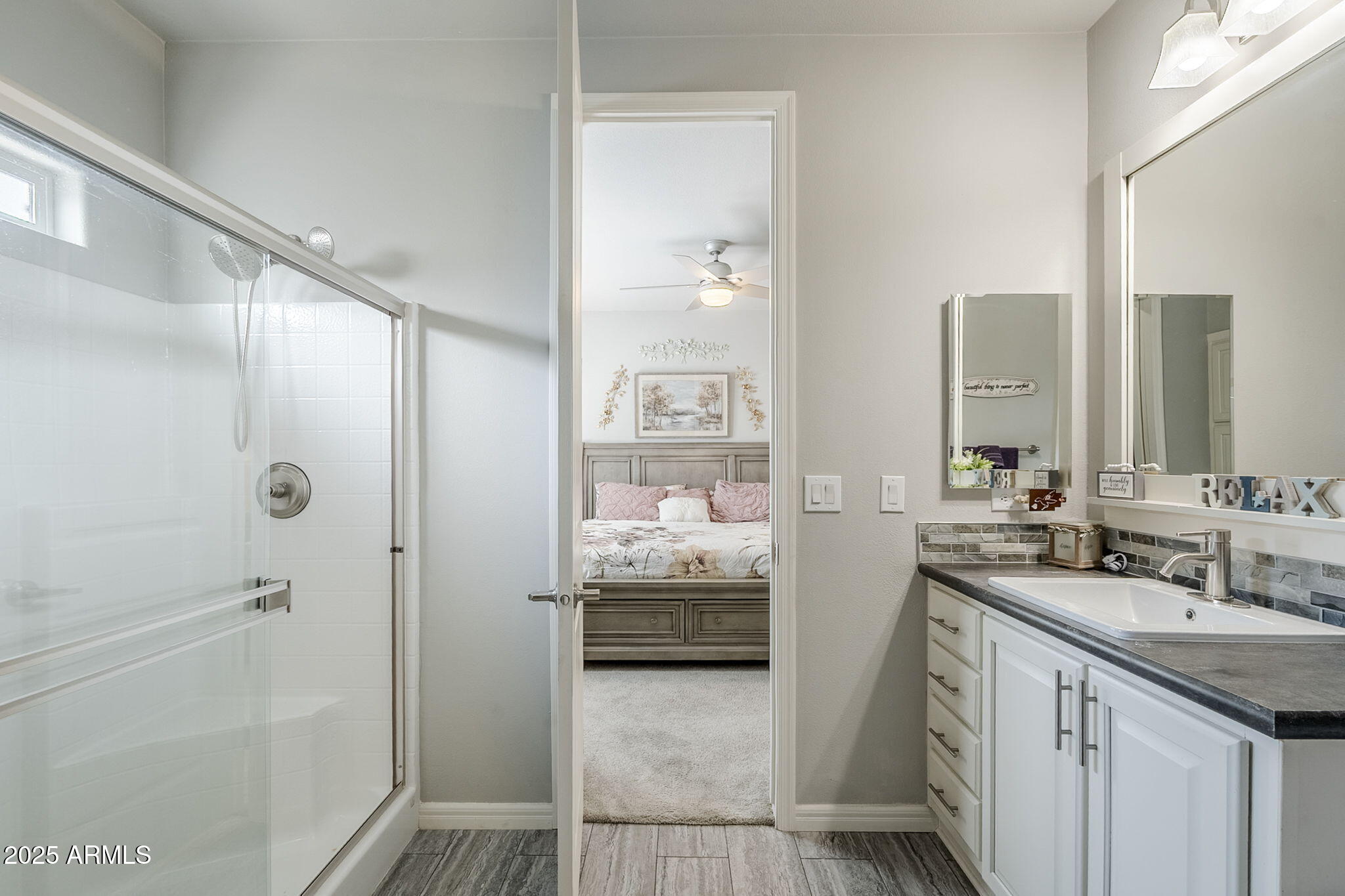 650 North Hawes Road, Unit 3215 Mesa, AZ 85207 - Photo 24 of 68 a bathroom with a double vanity sink and mirror