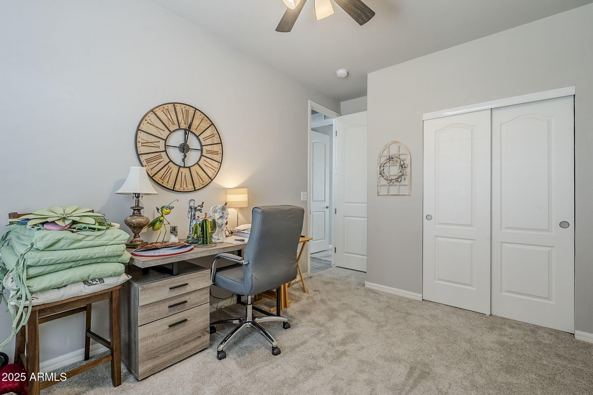 650 North Hawes Road, Unit 3215 Mesa, AZ 85207 - Photo 29 of 68 a room with furniture and paintings on the wall