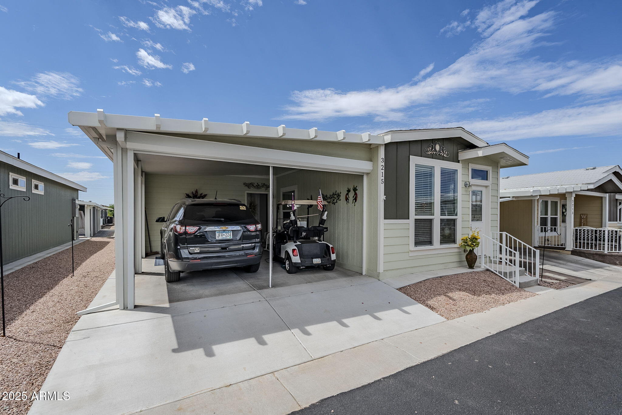 650 North Hawes Road, Unit 3215 Mesa, AZ 85207 - Photo 40 of 68 a view of a porch with table and chairs
