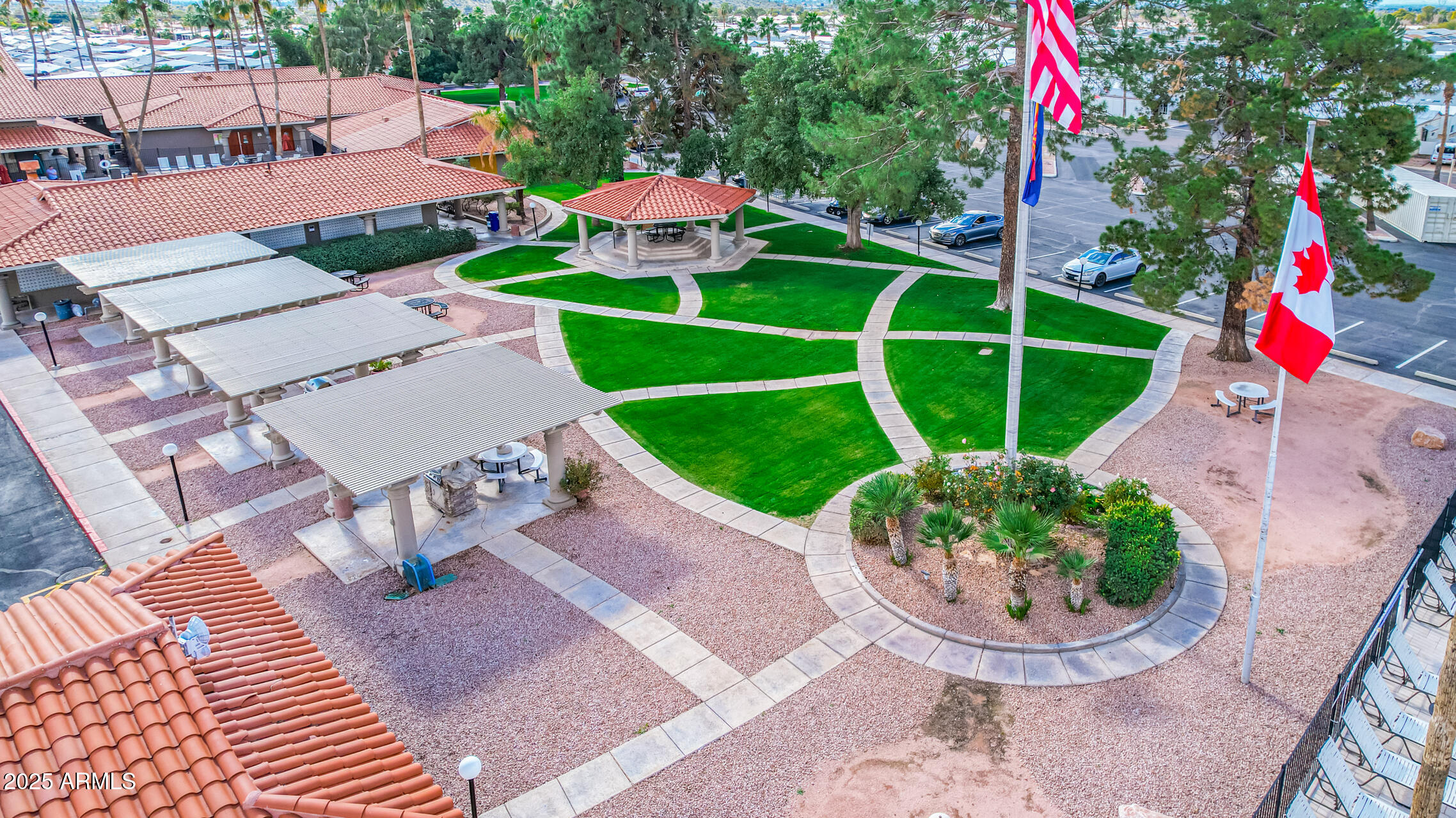 650 North Hawes Road, Unit 3215 Mesa, AZ 85207 - Photo 44 of 68 an aerial view of a house with a yard and potted plants