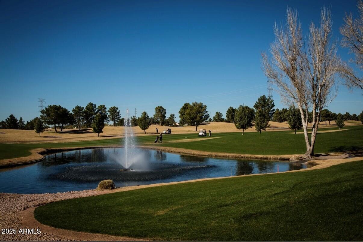 650 North Hawes Road, Unit 3215 Mesa, AZ 85207 - Photo 46 of 68 a view of a golf course with a lake