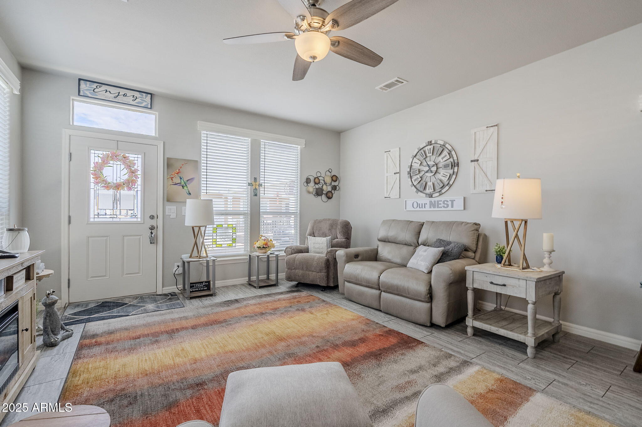 650 North Hawes Road, Unit 3215 Mesa, AZ 85207 - Photo 9 of 68 a living room with furniture a chandelier and a window