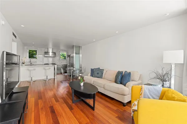a living room with furniture and a table