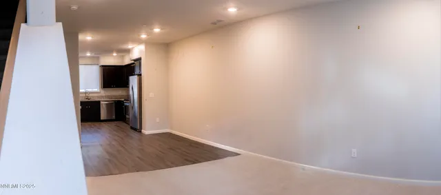 a view of a kitchen with an empty space and a kitchen