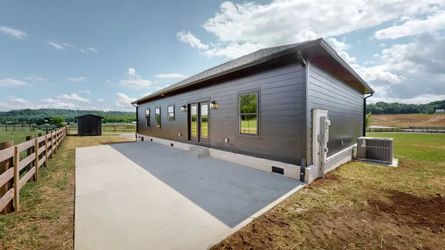 a view of a house with a backyard