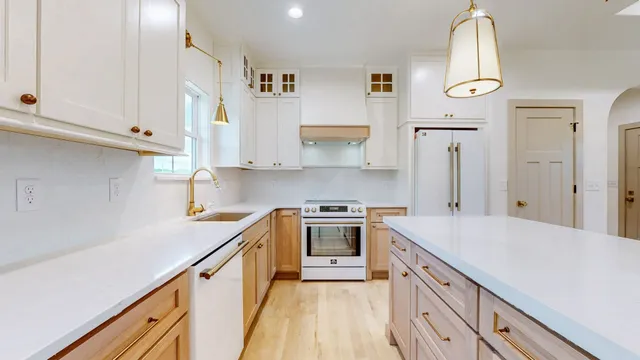 a kitchen with a sink stove and cabinets