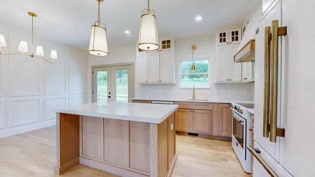 a kitchen with a sink stove and refrigerator
