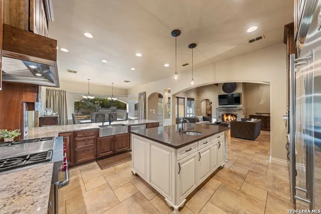 a large kitchen with a table and chairs